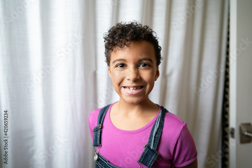 Grinning girl with freshly cut short hair photo