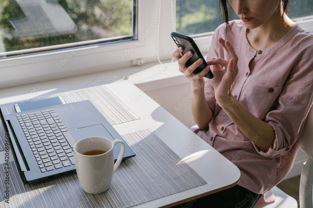 Woman Using Smartphone At Home Woman Using Smartphone At Home