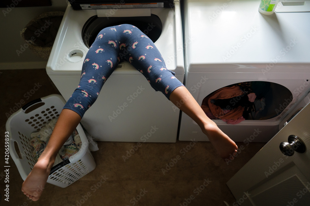 Child stuck upside down in washing machine Stock Photo Adobe Stock