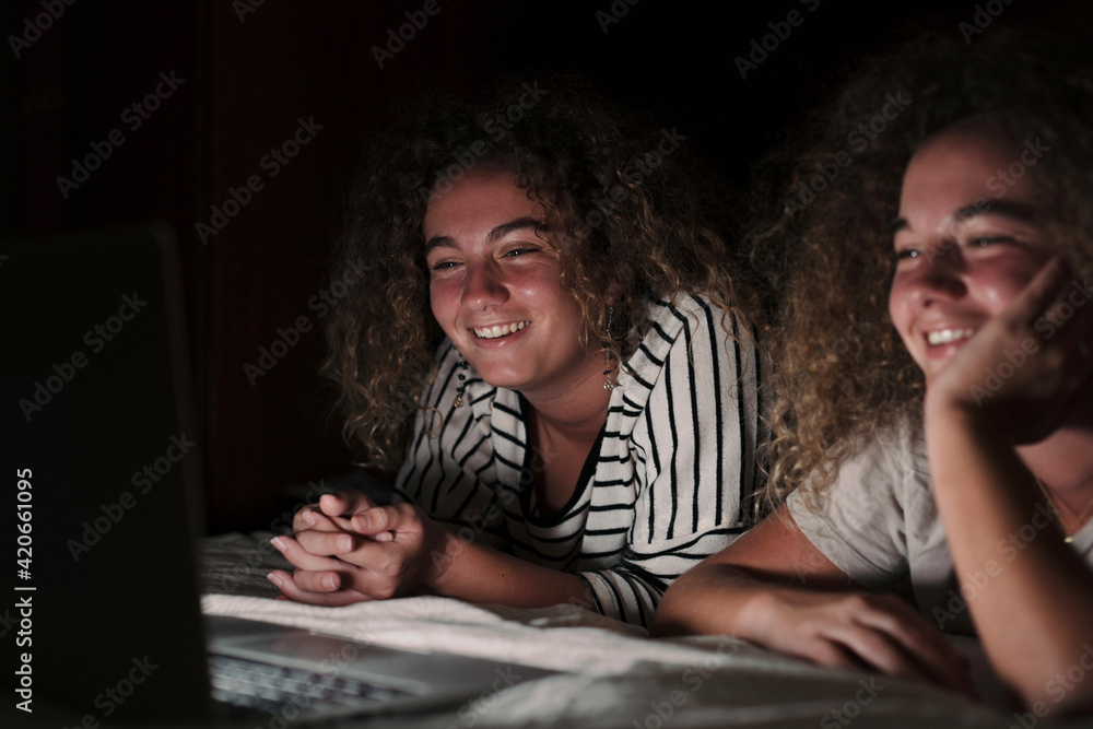 Twin sisters watching a movie Twin sisters watching a movie
