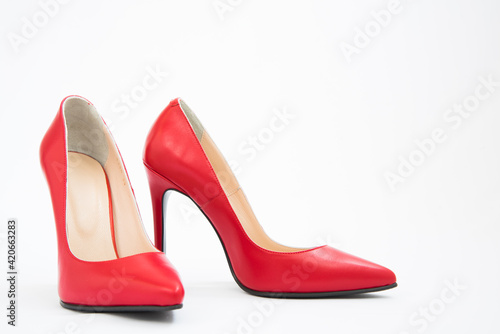 High-heeled shoes in red. Sexy shoes. White background. There is space for text