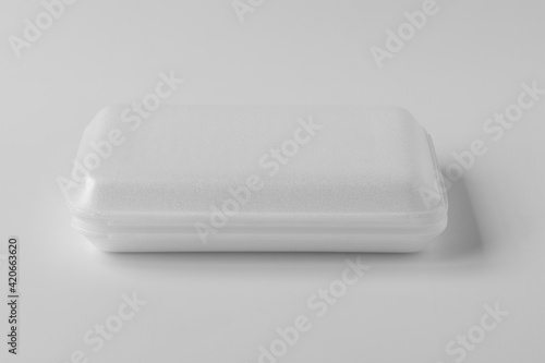  New white foam box for food on natural background.