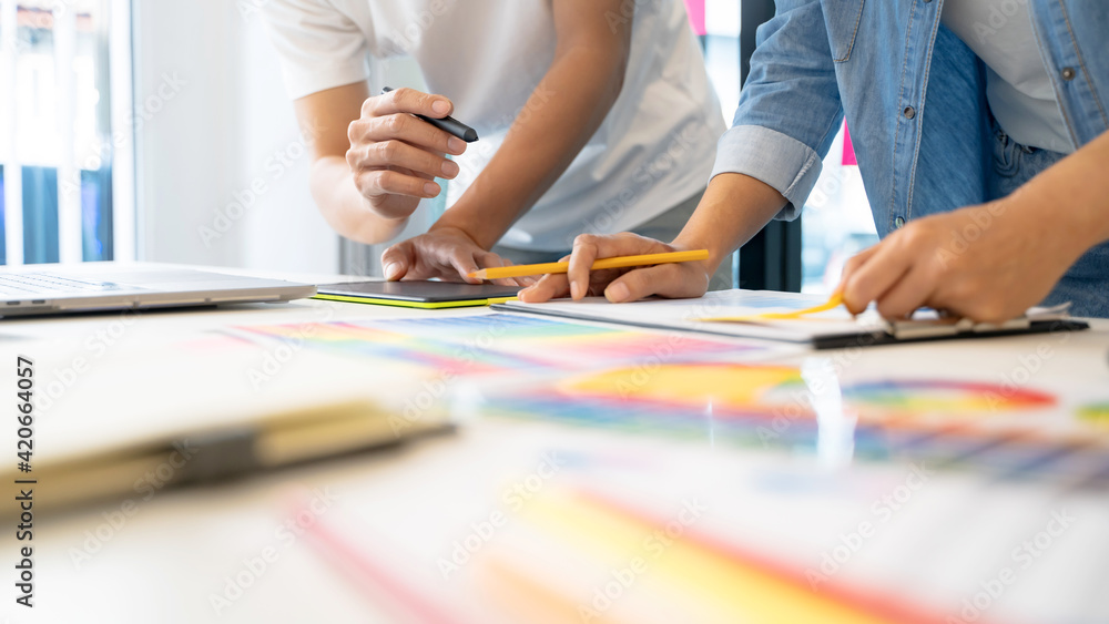 Diversity Startup team working with new project in modern meeting room.. Diversity Startup team working with new project in modern meeting room..