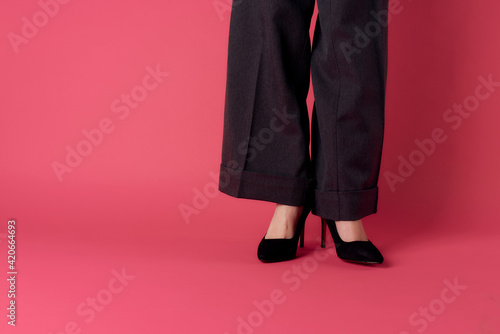 Womens elegant legs black shoes fashion pink background