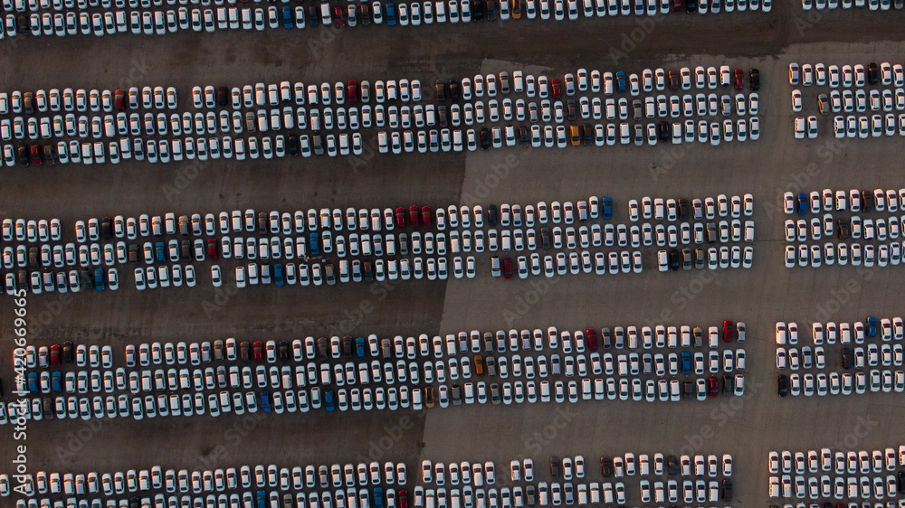 Large car parking in front of a car factory - grid filled with cars Large car parking in front of a car factory - grid filled with cars