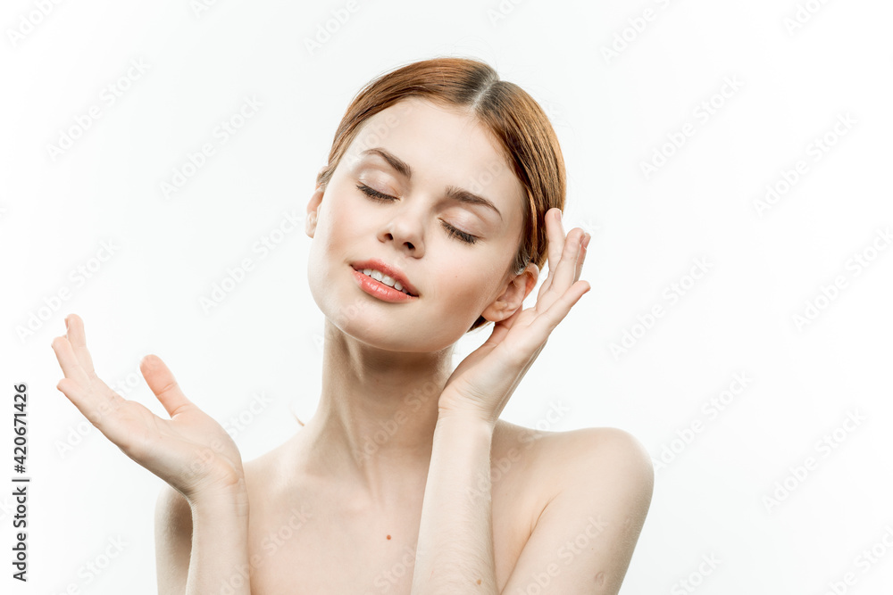 woman with closed eyes holding hands near face naked shoulders close-up emotions woman with closed eyes holding hands near face naked shoulders close-up emotions