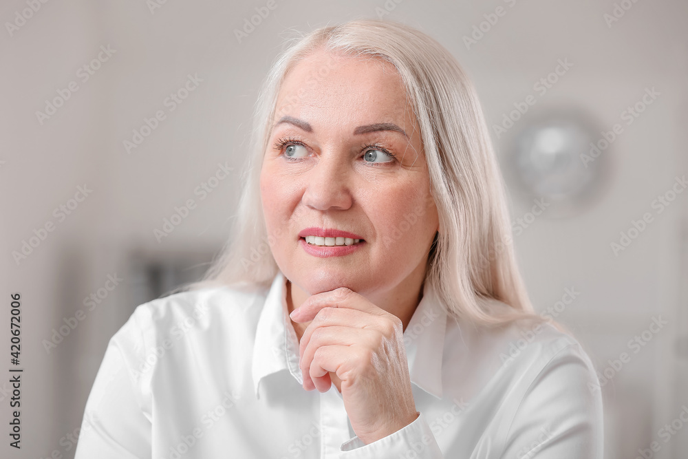 Portrait of happy mature woman in office Portrait of happy mature woman in office