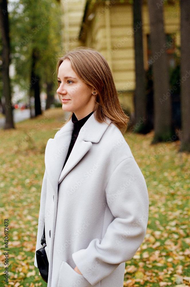 Pretty woman enjoys autumn day Pretty woman enjoys autumn day