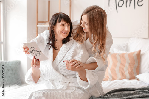 Adult daughter greeting her...