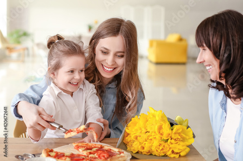 Young woman with her little...