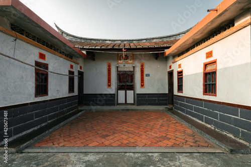 Old buildings in Daimei village, a traditional Chinese village with neat rows of houses in Zhangzhou, Fujian, China photo