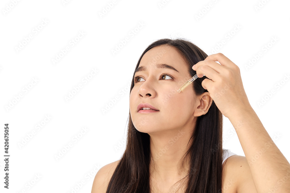 Woman applying oil serum from the pipette. Natural organic cosmetic Woman applying oil serum from the pipette. Natural organic cosmetic