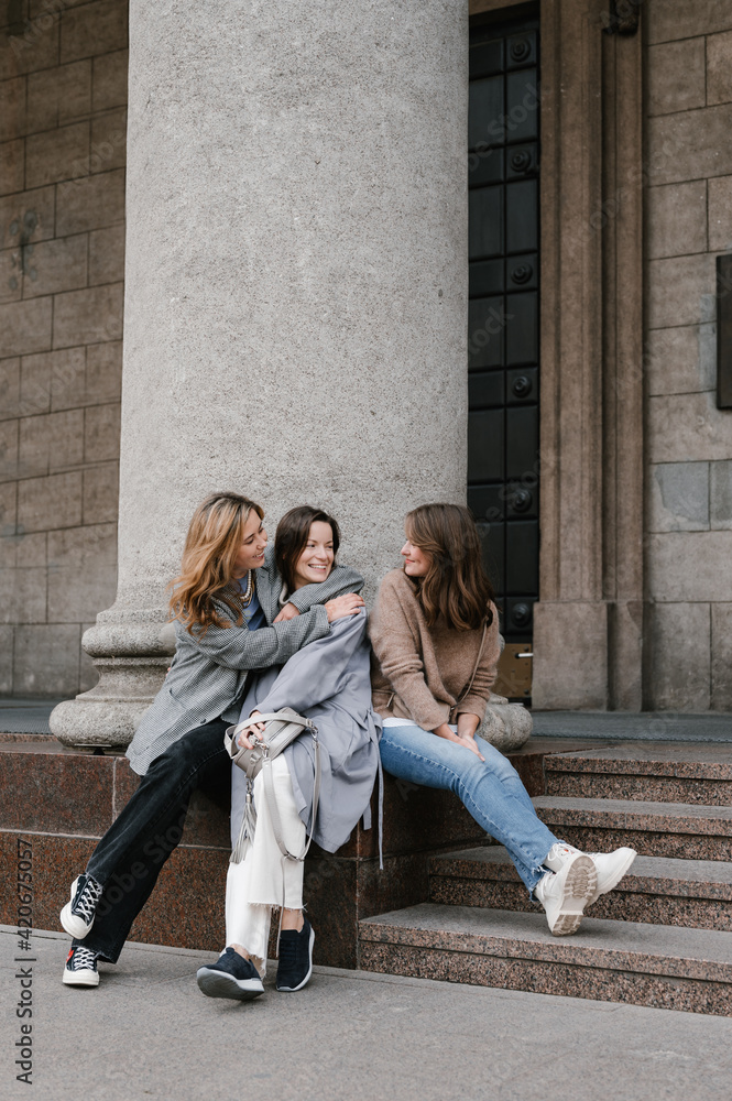 Group of cheerful friends in city Group of cheerful friends in city