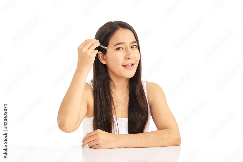 Woman applying oil serum from the pipette. Natural organic cosmetic Woman applying oil serum from the pipette. Natural organic cosmetic