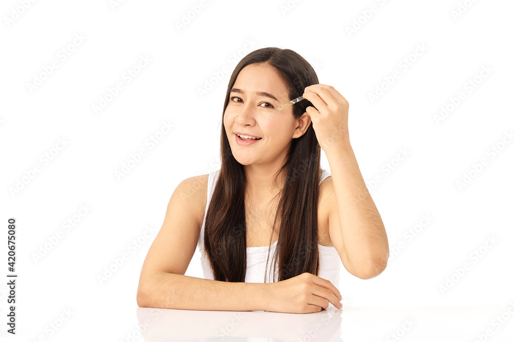 Woman applying oil serum from the pipette. Natural organic cosmetic Woman applying oil serum from the pipette. Natural organic cosmetic