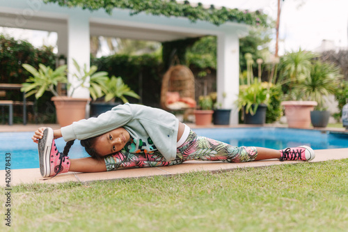 Kid stretching into a side split