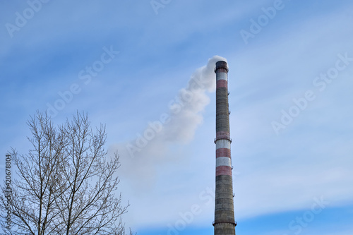 Industrial landscape, pipes with smoke. Air pollution by smoke paths