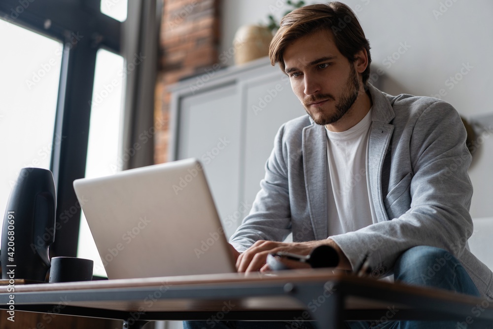 Male remote working from home and having work confrence video call. Male remote working from home and having work confrence video call.