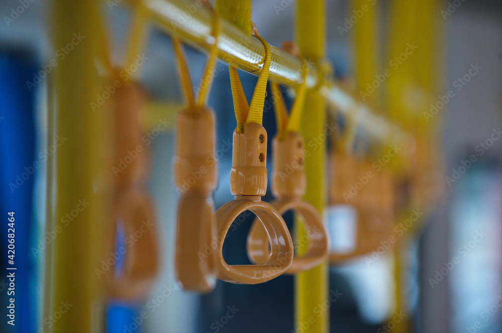Almaty, Kazakhstan - 01.28.2014 : Handrails made of plastic and rope in a city bus.