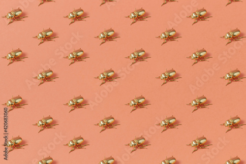 Pattern from metal golden scarab bugs. photo