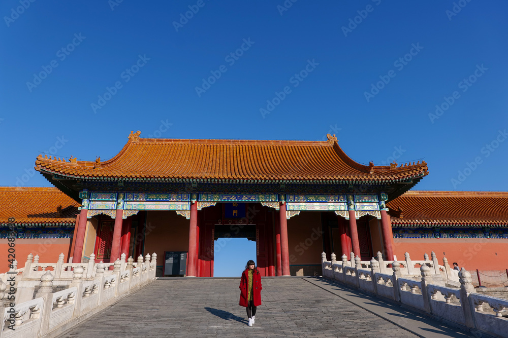 Fototapeta premium Young woman posing in Beijing's Forbidden City