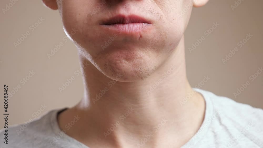 Unrecognizable man stuffed a mouthful and tries to chew. Unrecognizable man stuffed a mouthful and tries to chew.