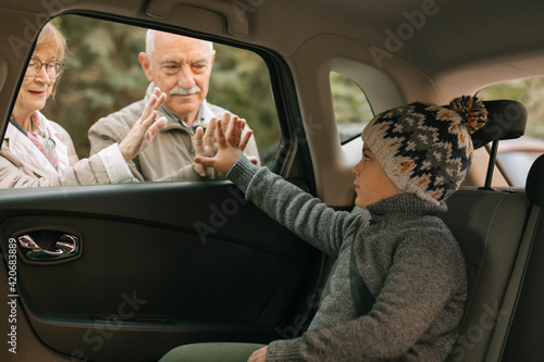 Grandparents greeting their grandson photo