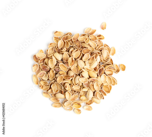 Pile of pistachios husks isolated on white background
