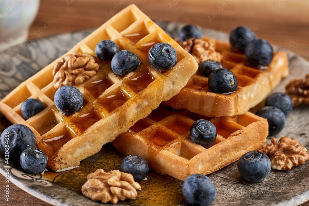 Waffles with blueberries, walnuts and maple syrup Waffles with blueberries, walnuts and maple syrup