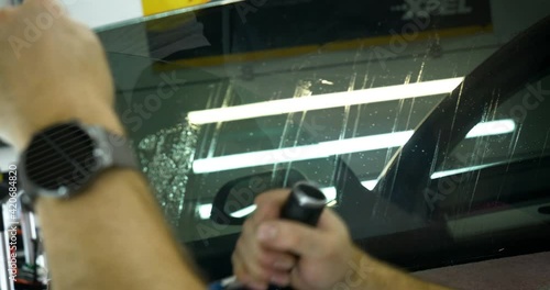 Applying tinting foil on a car window
