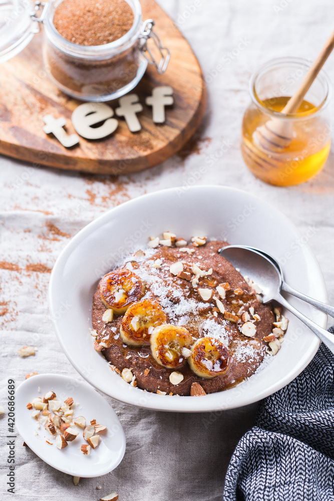 Teff grain porridge with banana topping for breakfast Teff grain porridge with banana topping for breakfast
