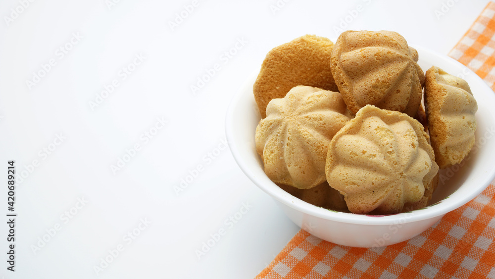 Malaysian traditional sweet egg sponge muffin cake, called Kuih Bahulu. Malaysian traditional sweet egg sponge muffin cake, called Kuih Bahulu.