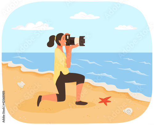 Girl with camera looks through lens at coastline. Photographer conducts photo session of sea