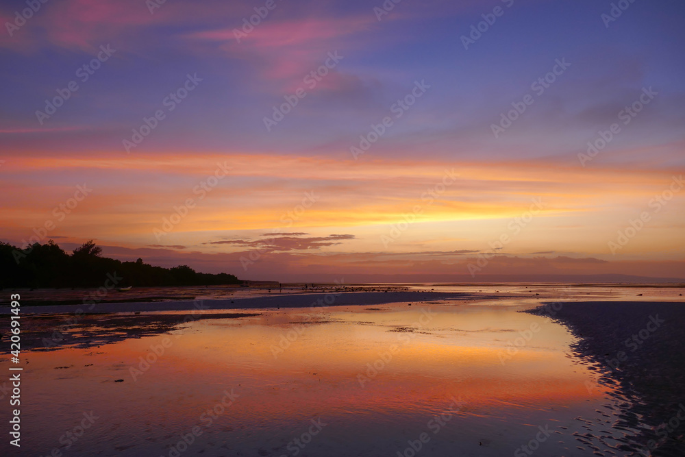 Peaceful and colorful sunset on Walakiri beach near Waingapu, Sumba island, East Nusa Tenggara, Indonesia