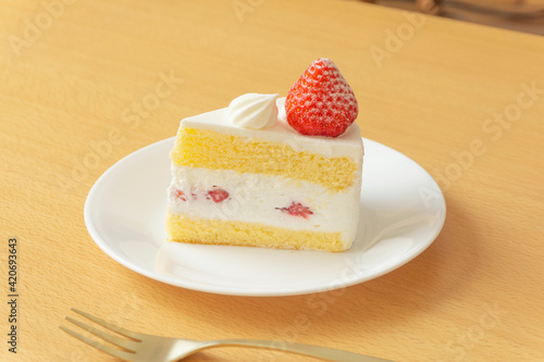 Fototapeta strawberry sponge cake on the table