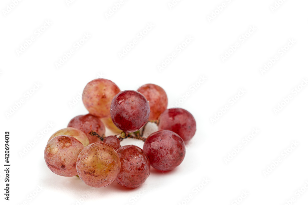 Fresh red grapes isolated on white background, copy space