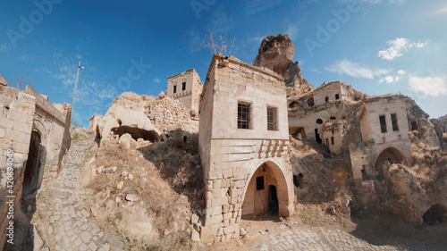 View of Ortahisar town old houses in rock formations from Ortahisar Castle. Cappadocia. Nevsehir Province. Turkey