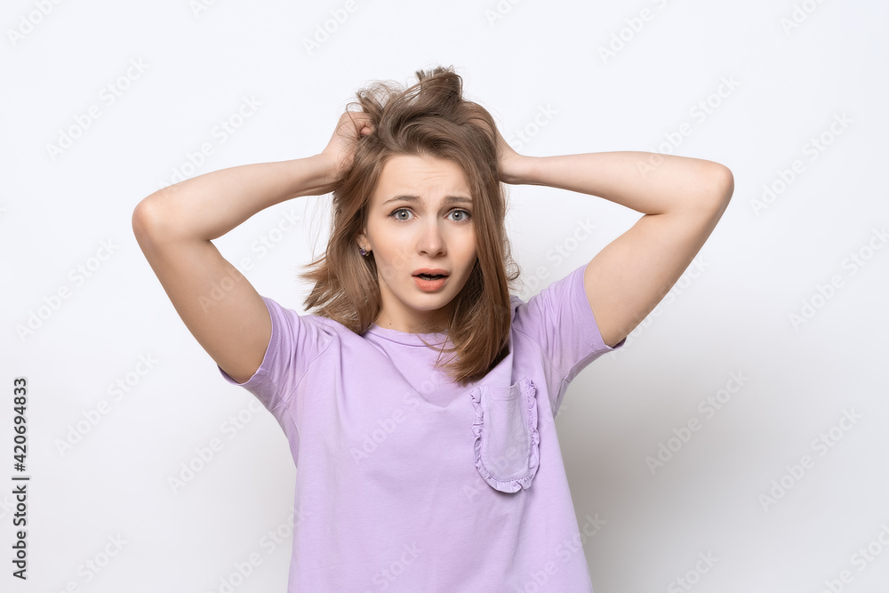 close up portrait of worried and anxious girl, grab head and panicking, staring alarmed, dont know what do close up portrait of worried and anxious girl, grab head and panicking, staring alarmed, dont know what do