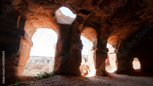 Turkey Achiksaray, suburb of Nevsehir. Ancient ruins of churches carved into sandy rocks. Cappadocia, Turkey