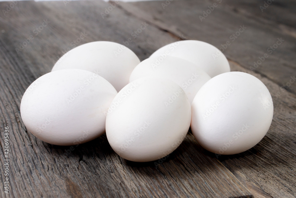 raw eggs on wood background.white egg raw eggs on wood background.white egg
