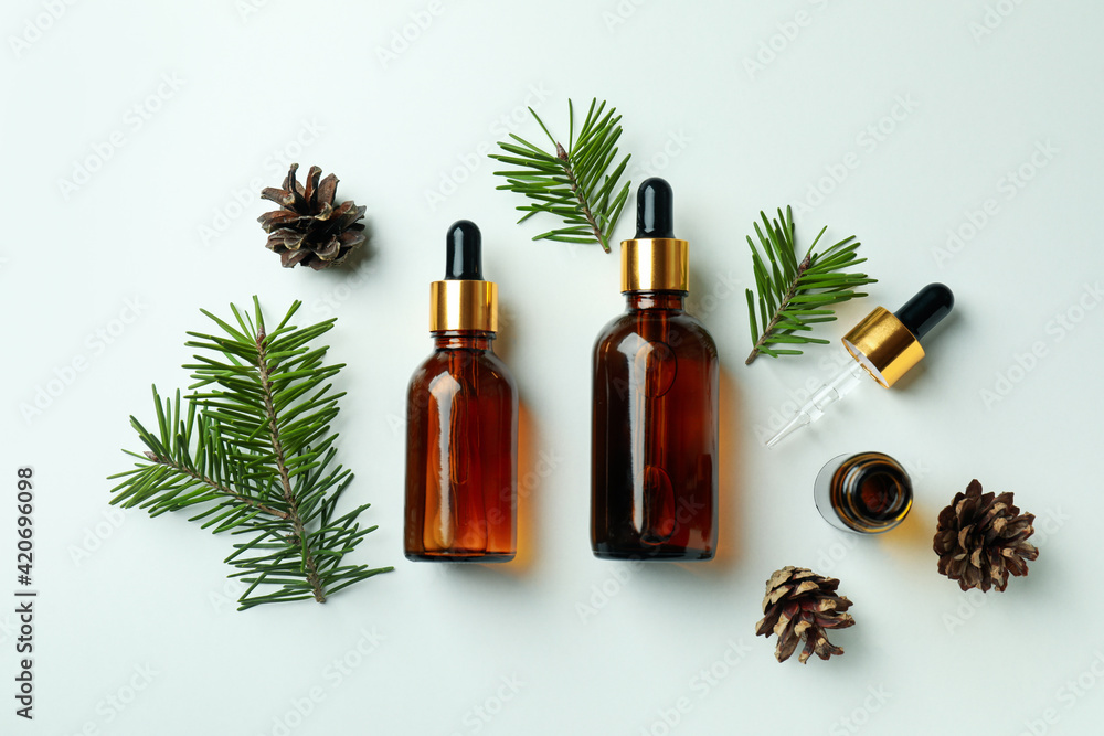 Flat lay with pine oil on white background Flat lay with pine oil on white background
