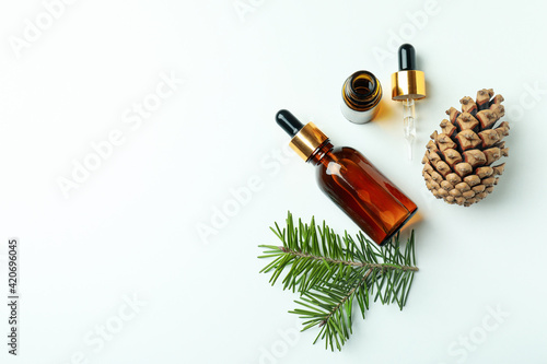 Flat lay with pine oil on white background