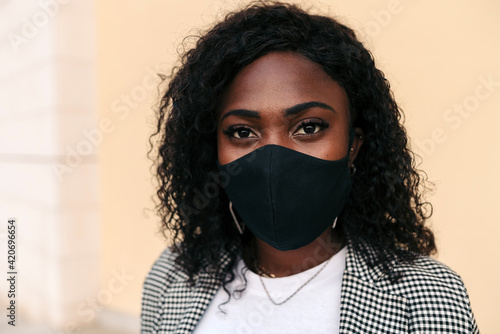 Black woman with face mask photo