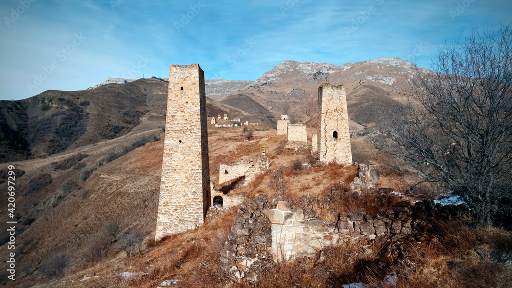 Falkhan village with the ruins of ancient battle towers and crypts. Russia, Republic of Ingushetia, Dzheyrakhsky region.