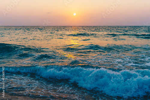 Colorful vibrant ocean sea wave beach summer with sunrise or sunset background landscape on vacation.