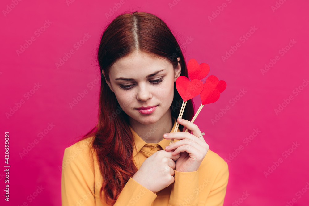 happy woman with paper hearts on sticks pink background Valentine's day