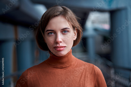 Woman portrait dark background Caucasian female headshoot photo