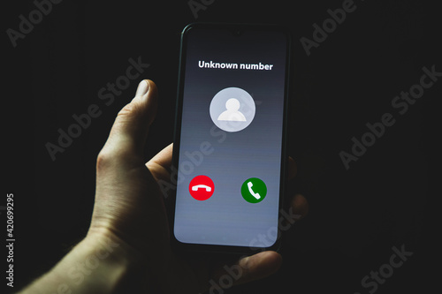 Incoming call from unknown number. Scam online on phone