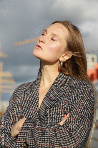 young woman with grey blazer photo