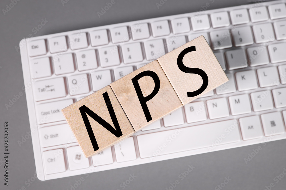 Business Acronym NPS as NET PROMOTER SCORE. text on wood cubes. text in black letters on wood blocks Business Acronym NPS as NET PROMOTER SCORE. text on wood cubes. text in black letters on wood blocks